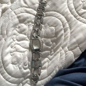 Fossil Brand silver watch with clear stones.